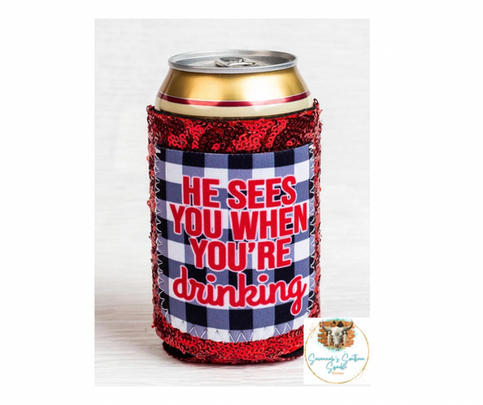 HE SEES YOU WHEN YOU'RE DRINKING SEQUIN CAN COOLER